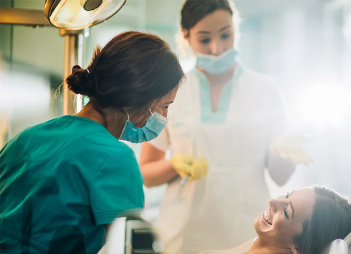 Dental team treating a patient in a dental practice