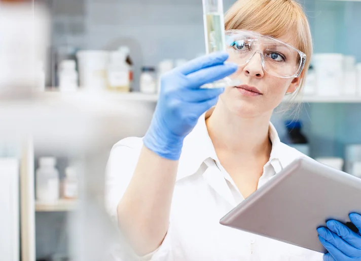 Laboratory technician examining a sample in a research lab